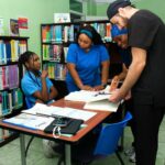 All Saints University Students in the library